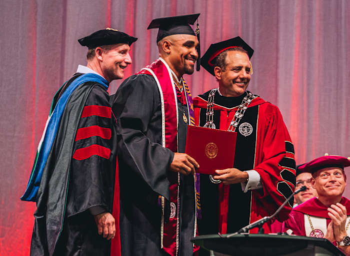 Hurts earned his second degree in May, a master’s in human relations.